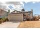 Charming two-story home with attached two car garage and well-manicured front yard at 9182 Weeping Willow Ct, Highlands Ranch, CO 80130