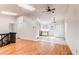 Open living area with hardwood floors, skylights, and an eat-in kitchen space at 9182 Weeping Willow Ct, Highlands Ranch, CO 80130