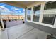 View of back patio featuring string lights, a fence and large windows at 12164 Poplar St, Thornton, CO 80602