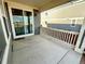 View of back patio featuring concrete floors and access to the house via sliding glass door at 12164 Poplar St, Thornton, CO 80602