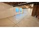 Unfinished basement showcasing cement floors, exposed ceiling, and white-wrapped walls at 12164 Poplar St, Thornton, CO 80602