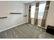 Bedroom with carpet, windows, and floating shelves at 12164 Poplar St, Thornton, CO 80602