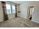 Bedroom with carpet, windows, and modern curtains at 12164 Poplar St, Thornton, CO 80602