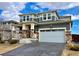 Beautiful two-story home with a well-manicured lawn, gray siding, and a two-car garage at 12164 Poplar St, Thornton, CO 80602