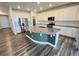 Spacious kitchen island with granite countertops, stainless steel appliances, and white cabinetry at 12164 Poplar St, Thornton, CO 80602