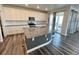 Modern kitchen with granite countertops, stainless steel appliances, and a large center island at 12164 Poplar St, Thornton, CO 80602