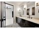 Clean bathroom with a double vanity and black cabinets at 44 Spyglass Dr, Littleton, CO 80123