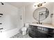 Bathroom with vanity, bathtub, and patterned tile floor at 44 Spyglass Dr, Littleton, CO 80123