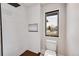 Modern bathroom with a walk-in shower and a window at 44 Spyglass Dr, Littleton, CO 80123