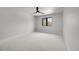 Simple bedroom with a window and light-colored carpet at 44 Spyglass Dr, Littleton, CO 80123