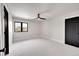 Bright bedroom with ceiling fan, window, and carpet at 44 Spyglass Dr, Littleton, CO 80123