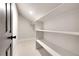 Spacious closet with ample shelving and hanging space at 44 Spyglass Dr, Littleton, CO 80123