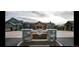 Columbine Country Club with stone entrance, exterior of building, and golf cart at 44 Spyglass Dr, Littleton, CO 80123