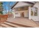 Steps leading up to a spacious deck with wooden planks at 44 Spyglass Dr, Littleton, CO 80123