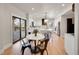 Modern kitchen with white cabinets, quartz countertops, and stainless steel appliances at 44 Spyglass Dr, Littleton, CO 80123