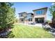 Spacious backyard with a green lawn and patio area, perfect for outdoor living at 350 Andromeda Ln, Castle Rock, CO 80108
