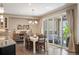 Bright dining area with sliding glass doors leading to a covered outdoor patio at 350 Andromeda Ln, Castle Rock, CO 80108
