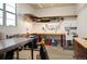Well-organized garage with work area, shelving, and pegboard for tools at 350 Andromeda Ln, Castle Rock, CO 80108