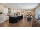 Open-concept kitchen with a large island, wooden floors, and ample cabinet space at 350 Andromeda Ln, Castle Rock, CO 80108
