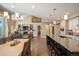 Open concept kitchen with dining area flowing into a living room with vaulted ceilings at 350 Andromeda Ln, Castle Rock, CO 80108