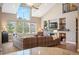 Inviting living room with a stone fireplace, large windows, and comfortable seating arrangements at 350 Andromeda Ln, Castle Rock, CO 80108