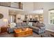 Open-concept living space with a spacious living room flowing into a modern kitchen with updated appliances at 350 Andromeda Ln, Castle Rock, CO 80108