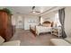 A large main bedroom with a ceiling fan, carpet floors, and neutral colored walls at 350 Andromeda Ln, Castle Rock, CO 80108