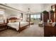 Spacious main bedroom with large windows, sitting area, and a ceiling fan at 350 Andromeda Ln, Castle Rock, CO 80108