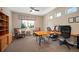 Bright and spacious office featuring multiple windows, ample workspace, and comfortable seating at 350 Andromeda Ln, Castle Rock, CO 80108