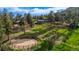Aerial view of home on a sprawling lot with fenced riding ring at 8537 S Doubleheader Hwy, Morrison, CO 80465