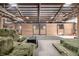 Spacious barn interior offering multiple horse stalls with hay and rubber mats for the animals at 8537 S Doubleheader Hwy, Morrison, CO 80465