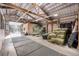 Barn interior with hay storage and mats along the floor at 8537 S Doubleheader Hwy, Morrison, CO 80465