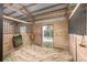 View of an individual horse stall with natural light and an open entryway to the outdoors at 8537 S Doubleheader Hwy, Morrison, CO 80465