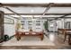 Bright dining room features a wood table, white walls, wood floors and exposed beam ceiling at 8537 S Doubleheader Hwy, Morrison, CO 80465