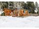 Quaint home with wood-shingle siding and a snow-covered yard at 8537 S Doubleheader Hwy, Morrison, CO 80465