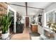 Rustic kitchen with an antique stove, wood beams, and natural light at 8537 S Doubleheader Hwy, Morrison, CO 80465