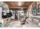 Cozy living space with an eclectic mix of decor and a view into the kitchen area at 8537 S Doubleheader Hwy, Morrison, CO 80465