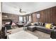 Cozy living room includes wood paneled walls, a large sectional couch and bunk beds at 8537 S Doubleheader Hwy, Morrison, CO 80465