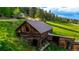 Rustic log outbuilding featuring vintage charm and abundant natural light at 8537 S Doubleheader Hwy, Morrison, CO 80465