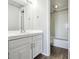 Bathroom with white vanity, tub, and shower at 3047 W 47Th Ave # 506, Denver, CO 80211