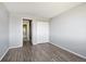 Bedroom with wood-look floors and access to bathroom at 3047 W 47Th Ave # 506, Denver, CO 80211