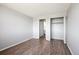 Bedroom with wood-look floors and mirrored closet at 3047 W 47Th Ave # 506, Denver, CO 80211