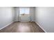 Spacious bedroom with wood-look floors and large window at 3047 W 47Th Ave # 506, Denver, CO 80211