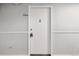 Simple white apartment entry door with a keypad lock at 3047 W 47Th Ave # 506, Denver, CO 80211