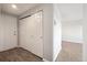 Bright entryway with wood-look floors and mirrored closet doors at 3047 W 47Th Ave # 506, Denver, CO 80211