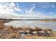 Peaceful lake view with partially frozen surface at 3047 W 47Th Ave # 506, Denver, CO 80211