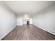 Open concept living room with wood-look floors and kitchen view at 3047 W 47Th Ave # 506, Denver, CO 80211