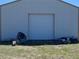 Exterior front view of a barn in a rural area at 554 E Pleasant Ave, Byers, CO 80103