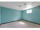 Unfinished basement with small window, carpeted flooring, and painted walls awaiting customization at 554 E Pleasant Ave, Byers, CO 80103