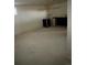 View of a basement with a black bar and a small window at 554 E Pleasant Ave, Byers, CO 80103